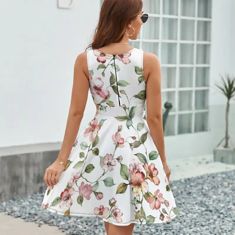 Ladies sleeveless white floral dress featuring a vibrant colorful floral print