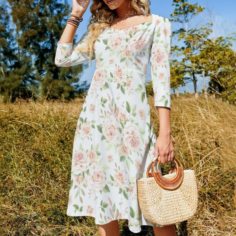 Floral print midi dress with a rose print sweetheart neckline and three-quarter sleeves