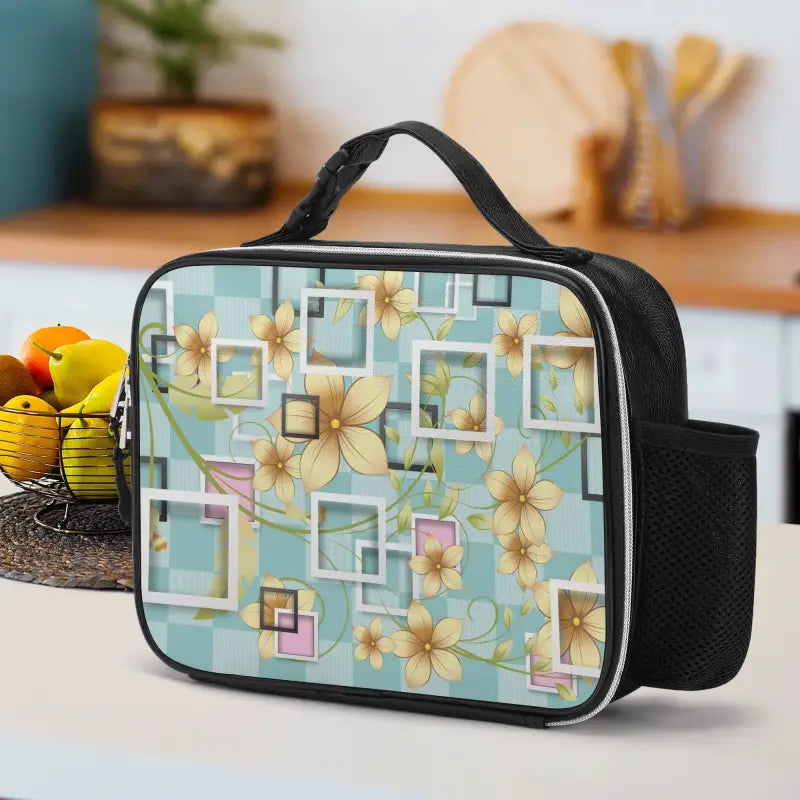 Floral lunch bag with black handle and trim for stylish meal trips on-the-go
