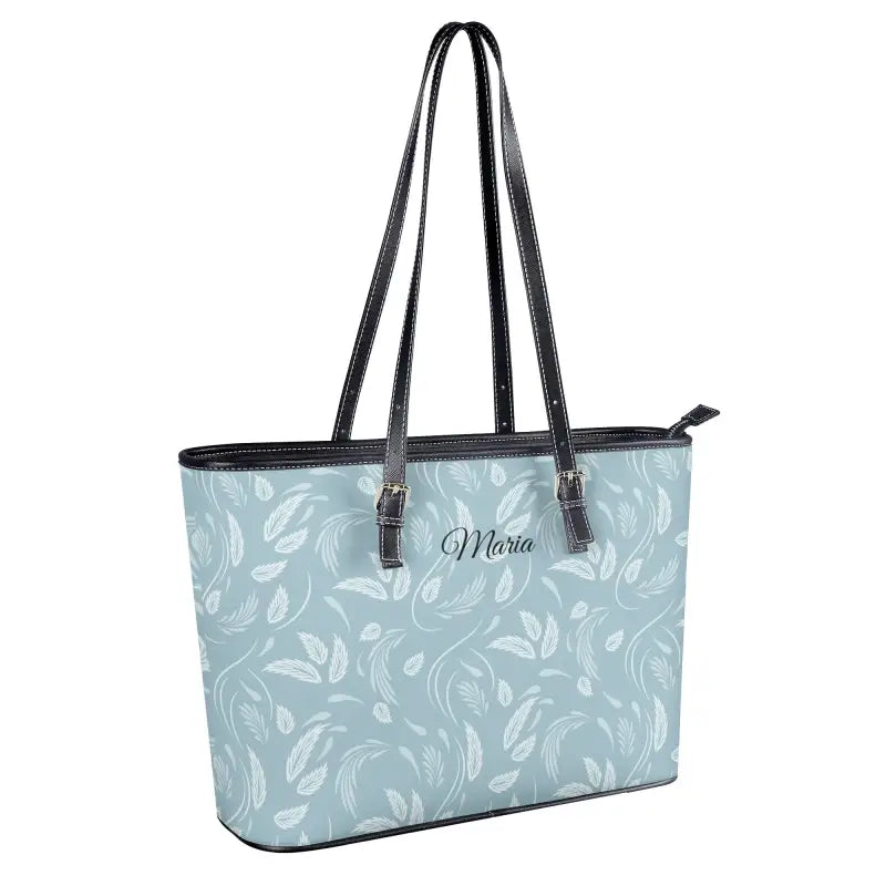 Light blue floral shoulder tote bag with dark handles, perfect for style and snacks