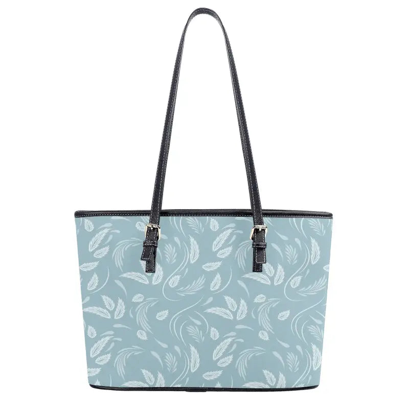 Light blue floral pattern tote bag with black leather trim for stylish snack carrying