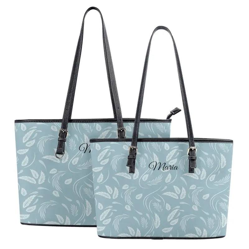 Light blue personalized floral shoulder tote with a black trim and the name Maria