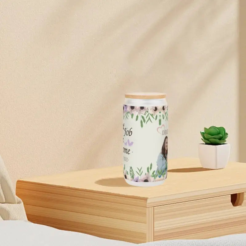 Cylindrical ceramic jar with floral designs and bamboo lid, perfect for beer or cocktails