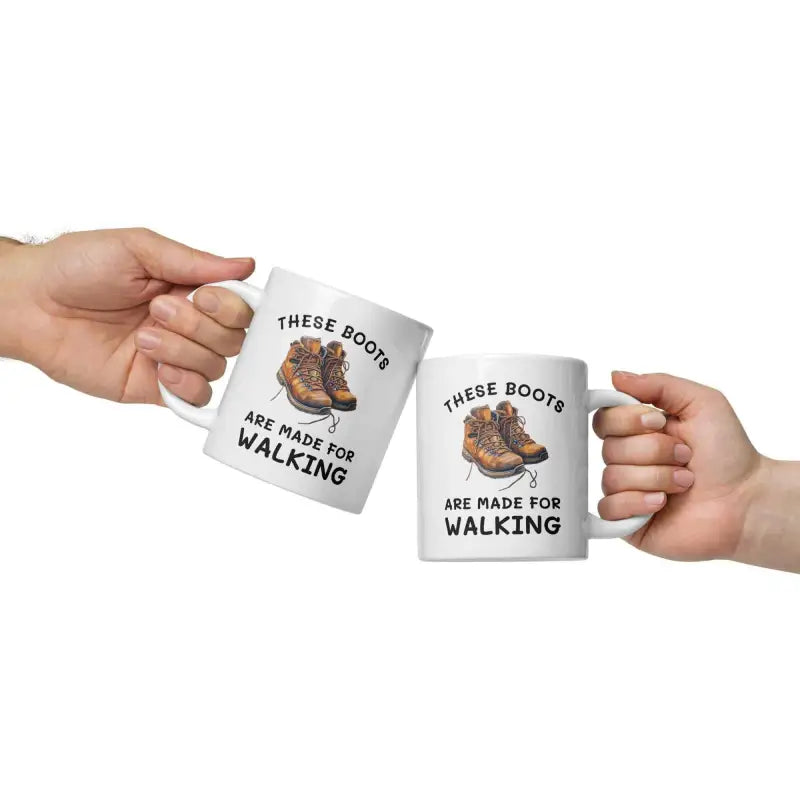 Two white mugs for outdoor lovers featuring hiking boots and fun coffee text
