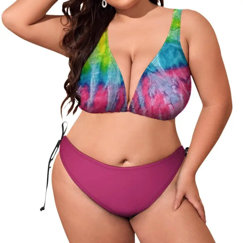 Vibrant multi color bikini top with solid magenta bottoms for a fun beach look