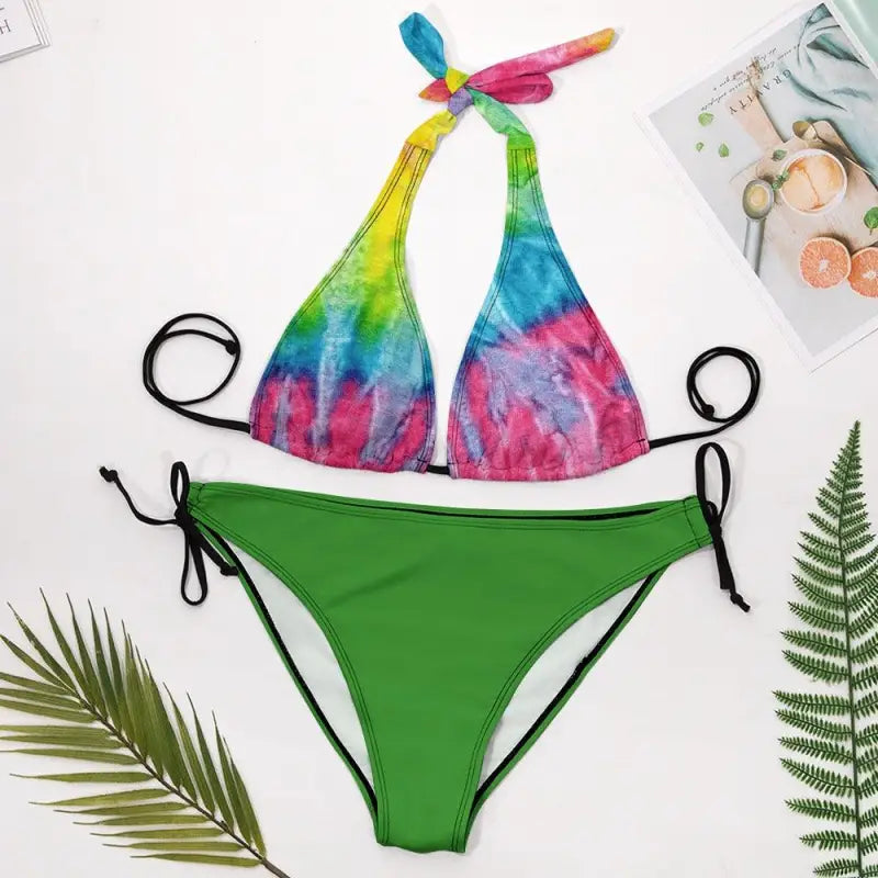 Vibrant multi color bikini top with solid green bottoms for a fun beach vibe