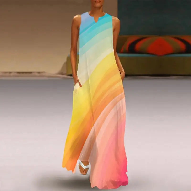 Flowing pastel rainbow sleeveless maxi dress in a blue to pink gradient