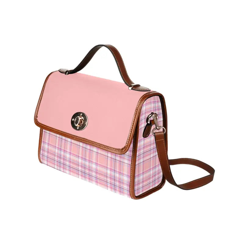 Pink plaid canvas handbag with brown trim and gold clasp for effortlessly carrying style vibes