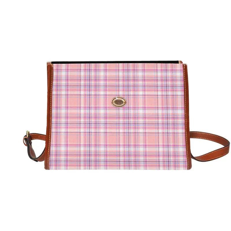 Pink plaid canvas handbag with brown leather trim for effortlessly carrying style vibes