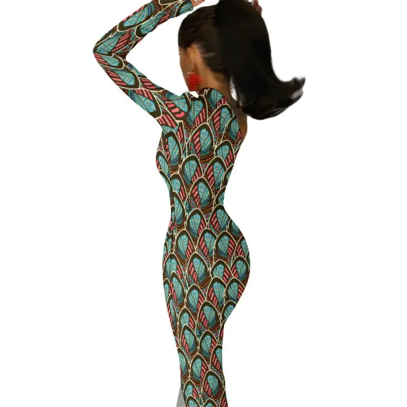 Woman in a vibrant Peacock Print sleeve slit dress with a fun twist