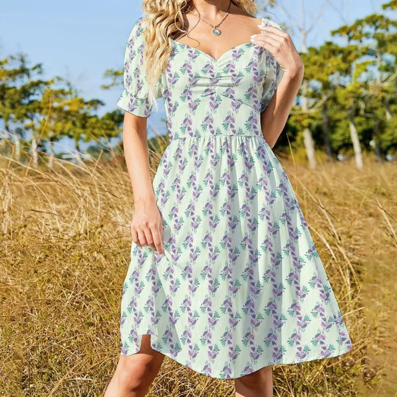 Floral sweetheart dress featuring a white fabric with a purple floral pattern and short sleeves