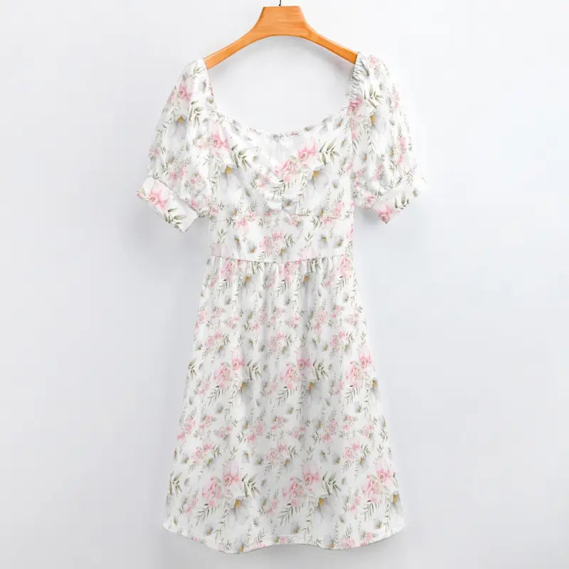 Floral print dress with puff sleeves on a hanger for women’s pink floral style