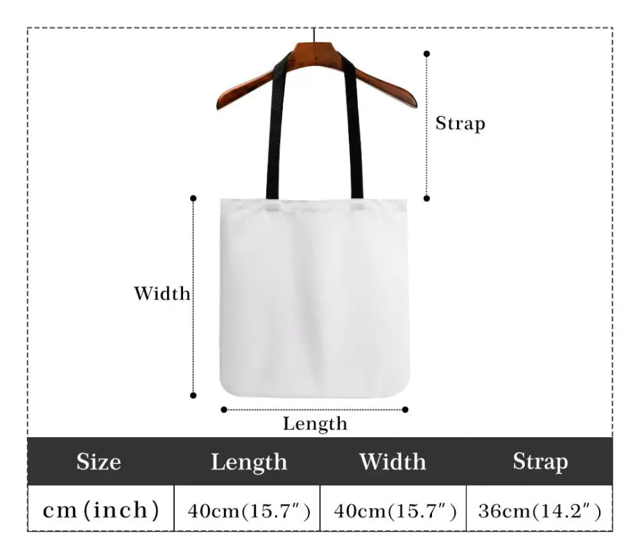 White canvas Christmas tote bag with handles hanging on a wooden hanger