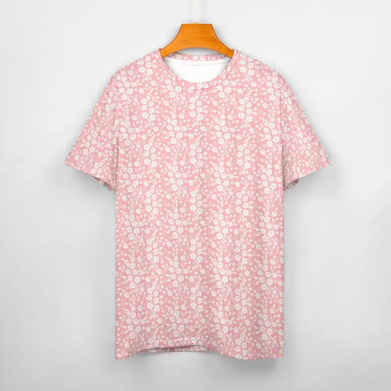 Pink Ditzy Floral short sleeve cotton t-shirt hanging on an orange hanger