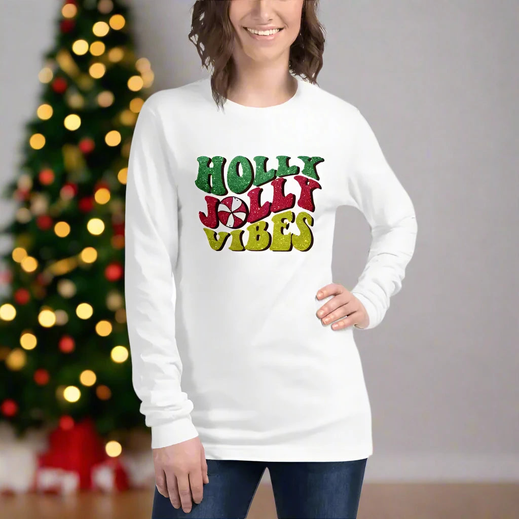 White long-sleeved sweatshirt featuring Holly Jolly Vibes in colorful print on soft cotton