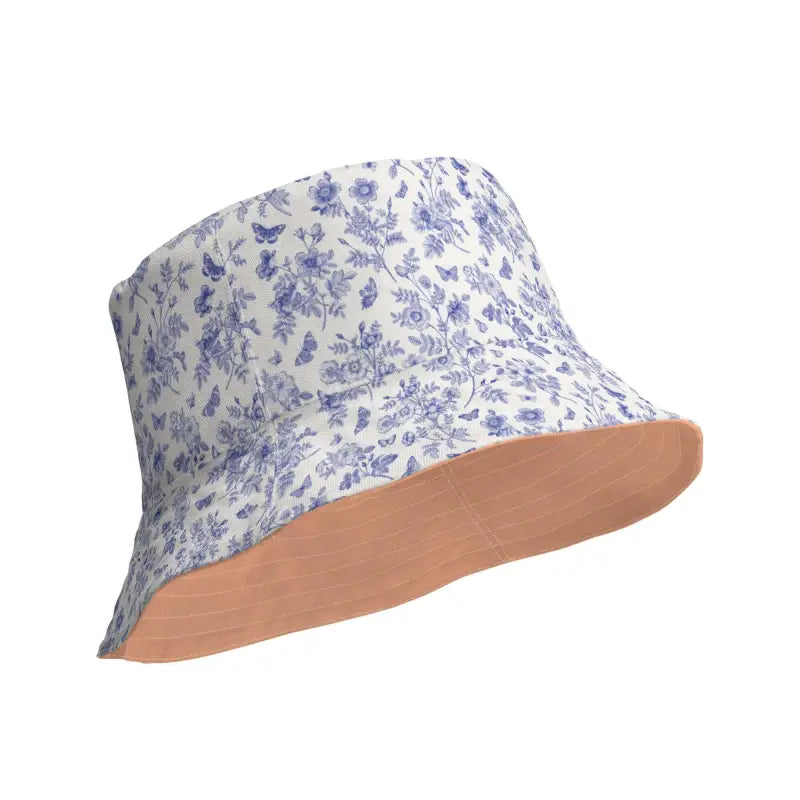 Reversible bucket hat with blue floral print and solid peach interior for stylish look