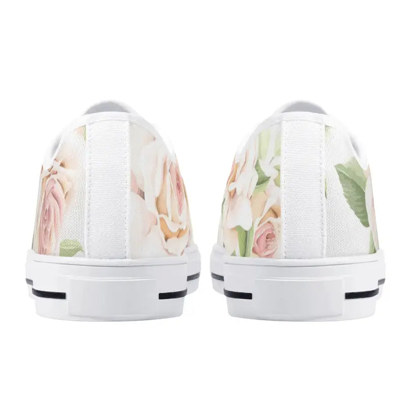 White slip-on canvas shoes featuring women’s rose print for a trendy floral look