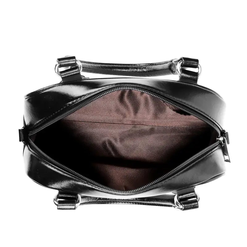 Black leather sunflower shoulder handbag with open zipper and brown interior for lunch dates