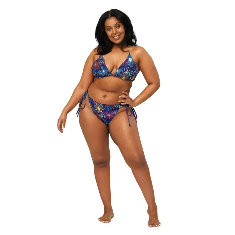 Woman rocking a blue floral string bikini in the Sunny Days and Colorful Waves set
