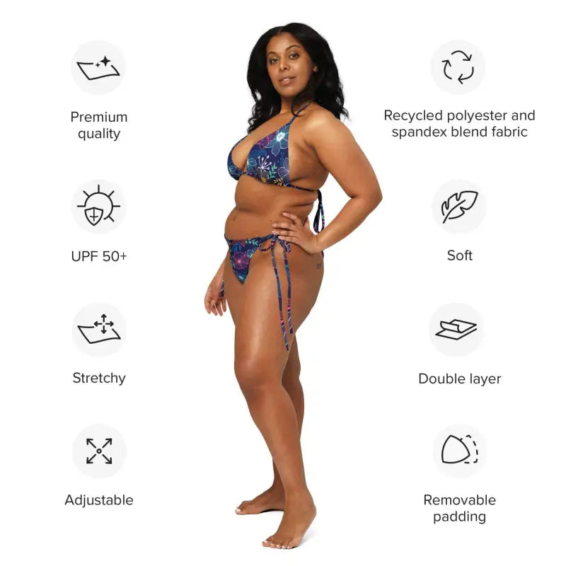 Woman with curly dark hair models a blue floral string bikini set for sunny days