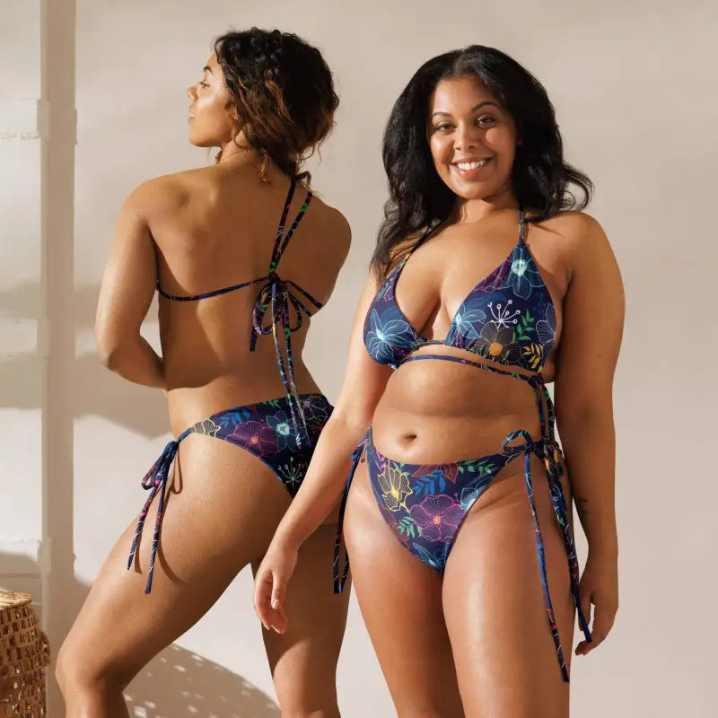 Two women in colorful floral string bikinis showcasing the Sunny Days bikini set