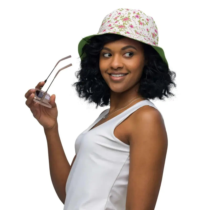 Woman in a floral print reversible bucket hat with rose floral print and sunglasses