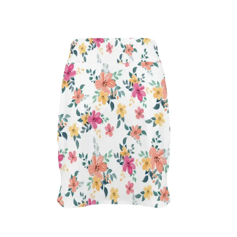 Floral golf skirt featuring colorful flowers on white, perfect for stylish women golfers