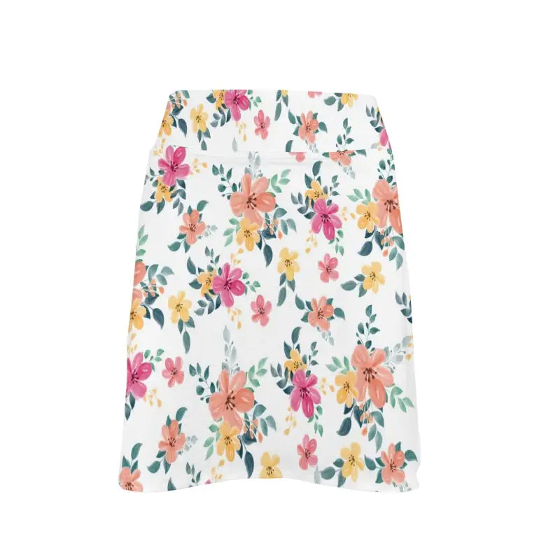 Floral golf skirt with colorful flowers and green leaves on a white background