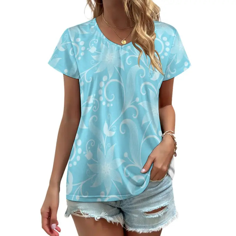 Light blue women’s floral v-neck t-shirt with subtle white swirl pattern for spring