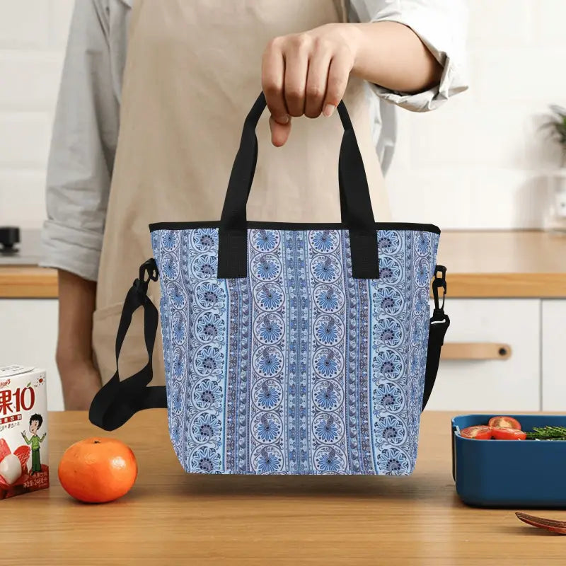 Blue print insulated tote bag with black handles and shoulder strap for stylish versatility