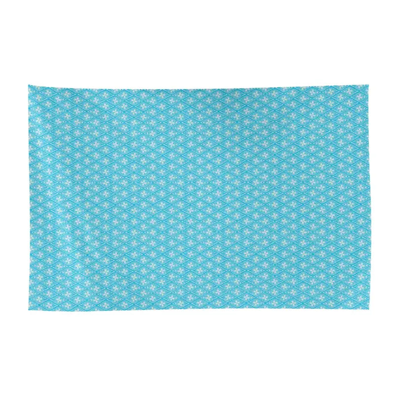Turquoise fabric with white flowers, perfect for a women’s sarong bikini cover