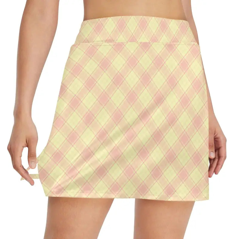 Pastel yellow and pink plaid athletic skirt perfect for stylish women on the go