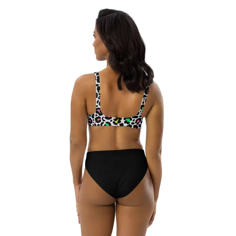 Woman rocking a colorful leopard print high-waisted bikini set from the back