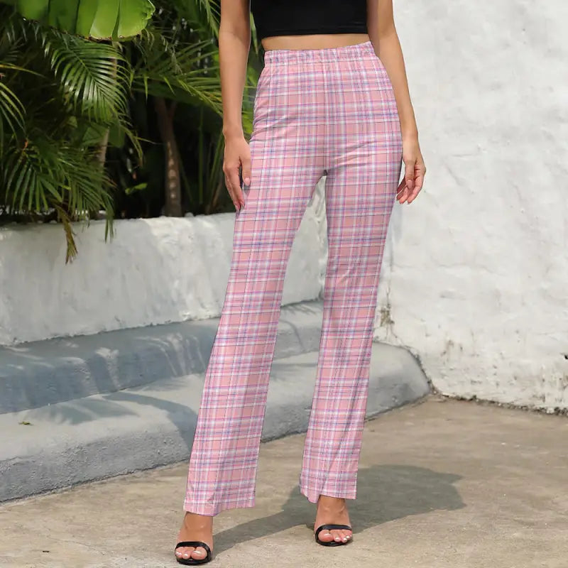 Woman wearing trendy pink plaid flared pants with a stylish wide-leg design