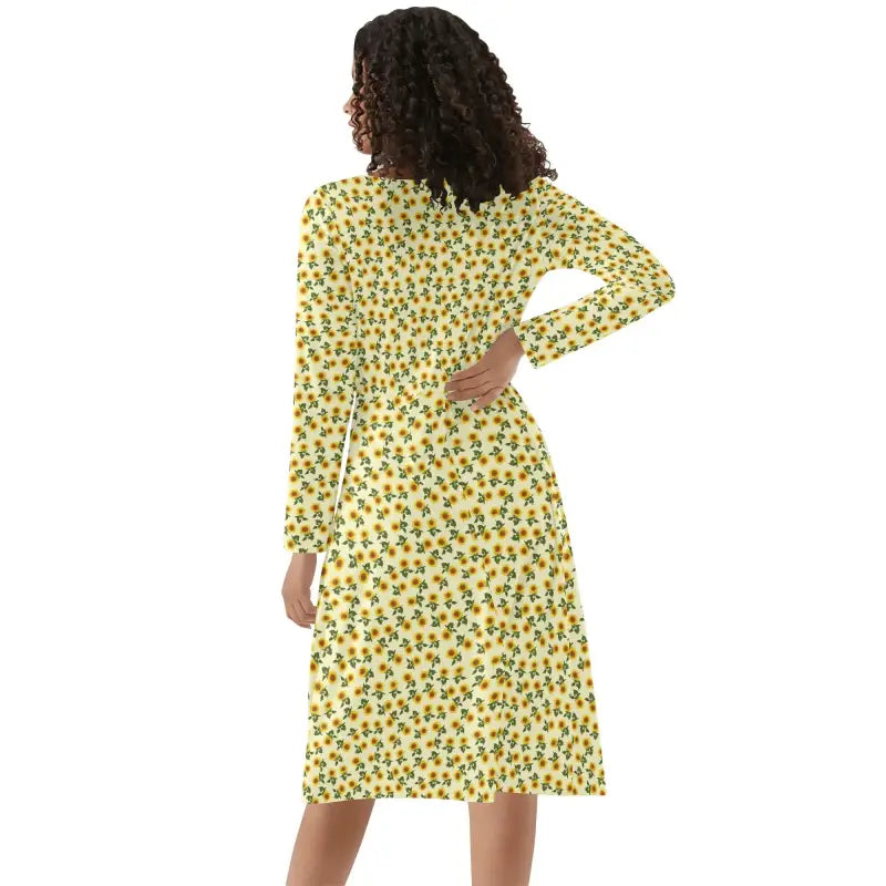 Yellow floral print Womens Sunflower V-Neck Long Sleeve Dress on a person with curly hair