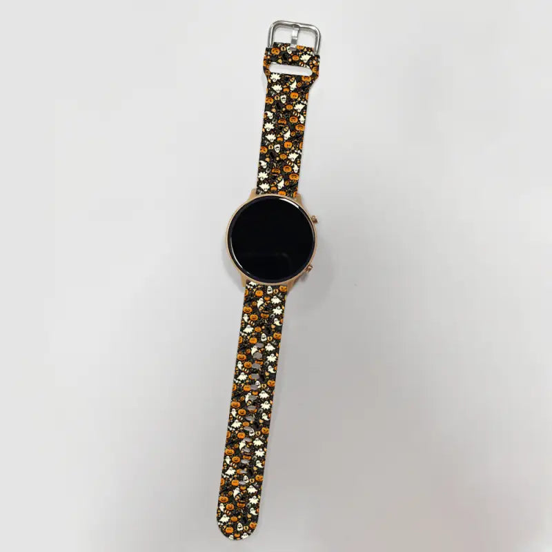 Wristwatch with a floral band and black face, perfect for Halloween vibes!