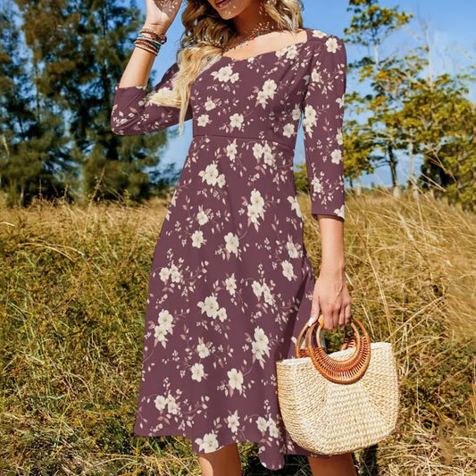 Floral print purple dress with three-quarter sleeves for the ultimate style statement.