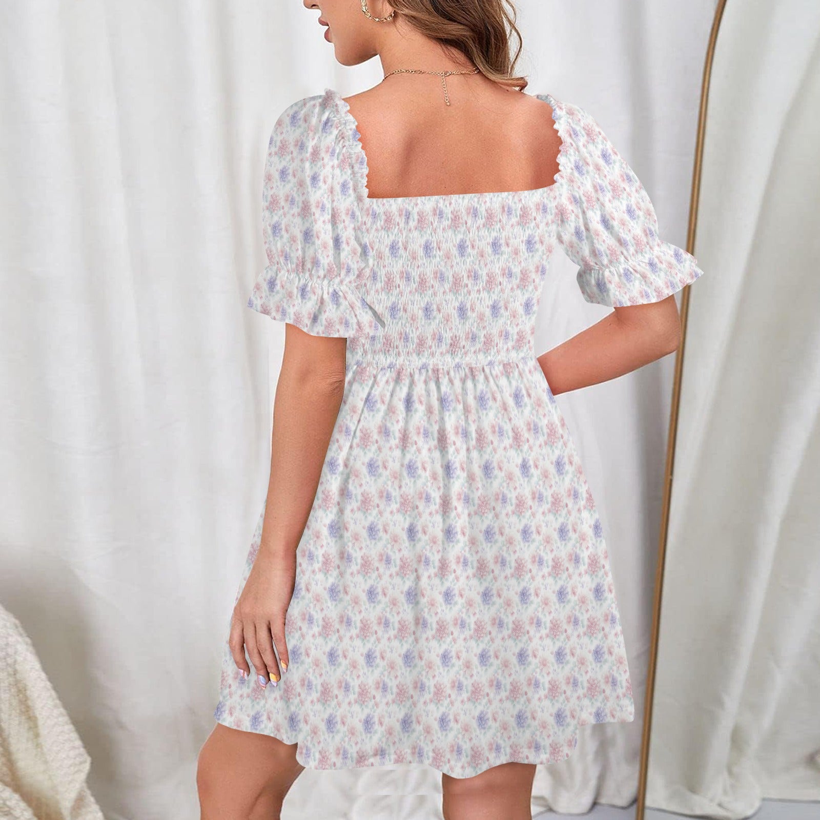Back view floral dress with shirred bodice and flared skirt