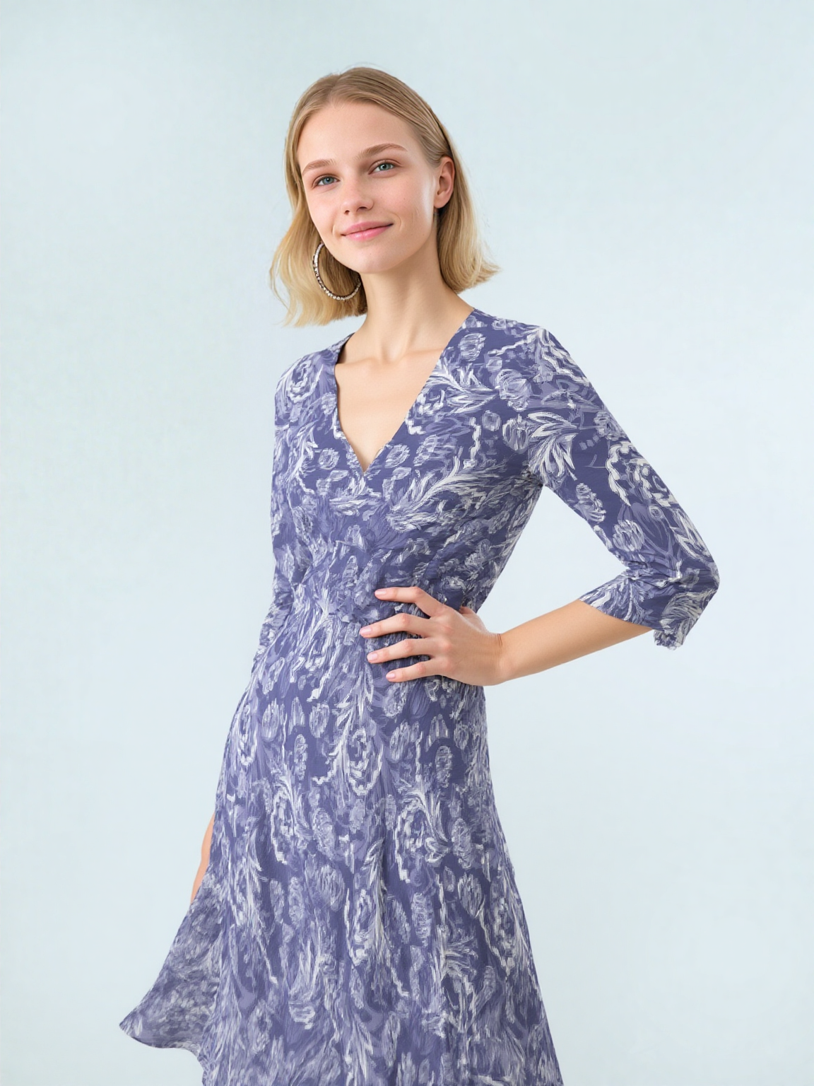 Blue floral midi dress angled view showing V neckline and elbow sleeves