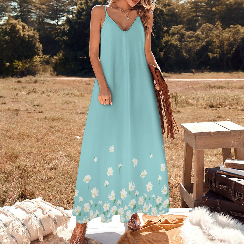 Blue summer maxi dress styled outdoors with soft floral hem