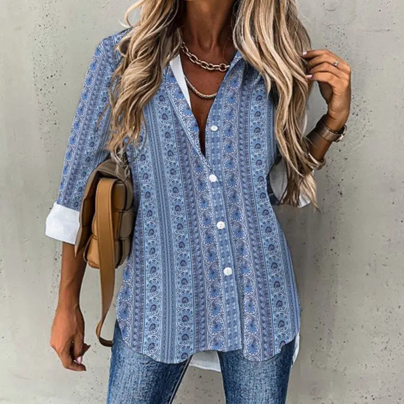 Blue vertical mosaic print blouse styled with denim and layered necklace