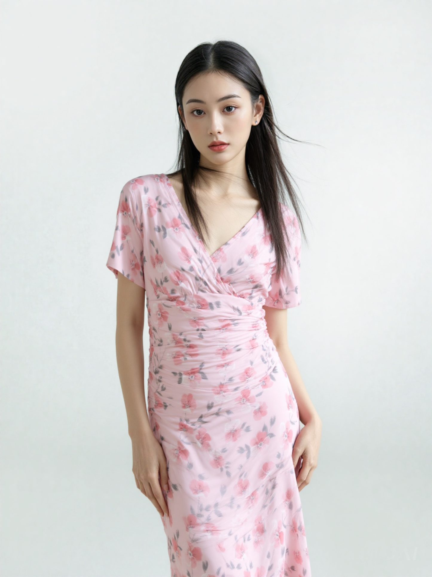 Blush pink floral ruched midi dress front view