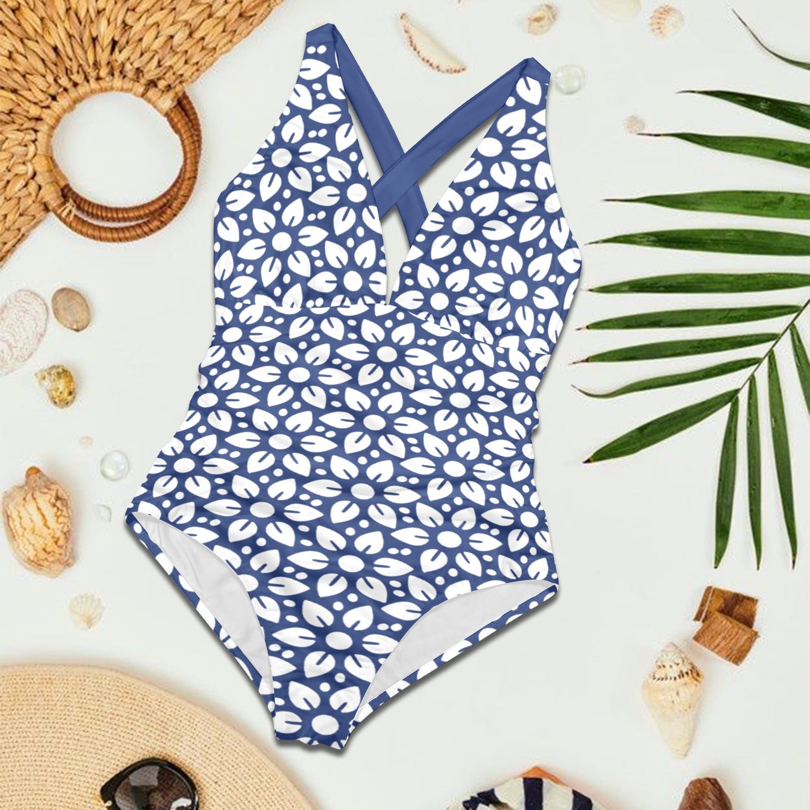 Flat lay of blue floral V-neck one-piece swimsuit