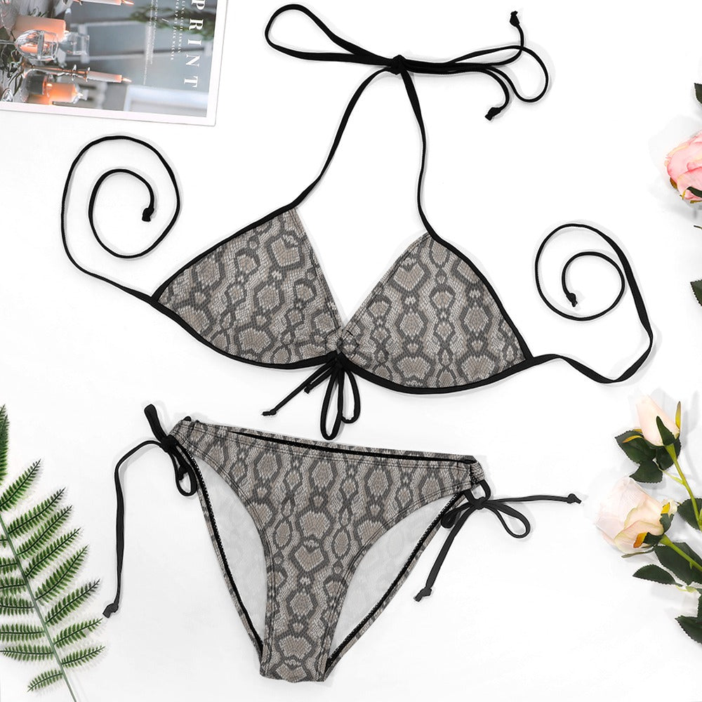 Flat lay of plus size snake print triangle bikini with tie-side bottoms