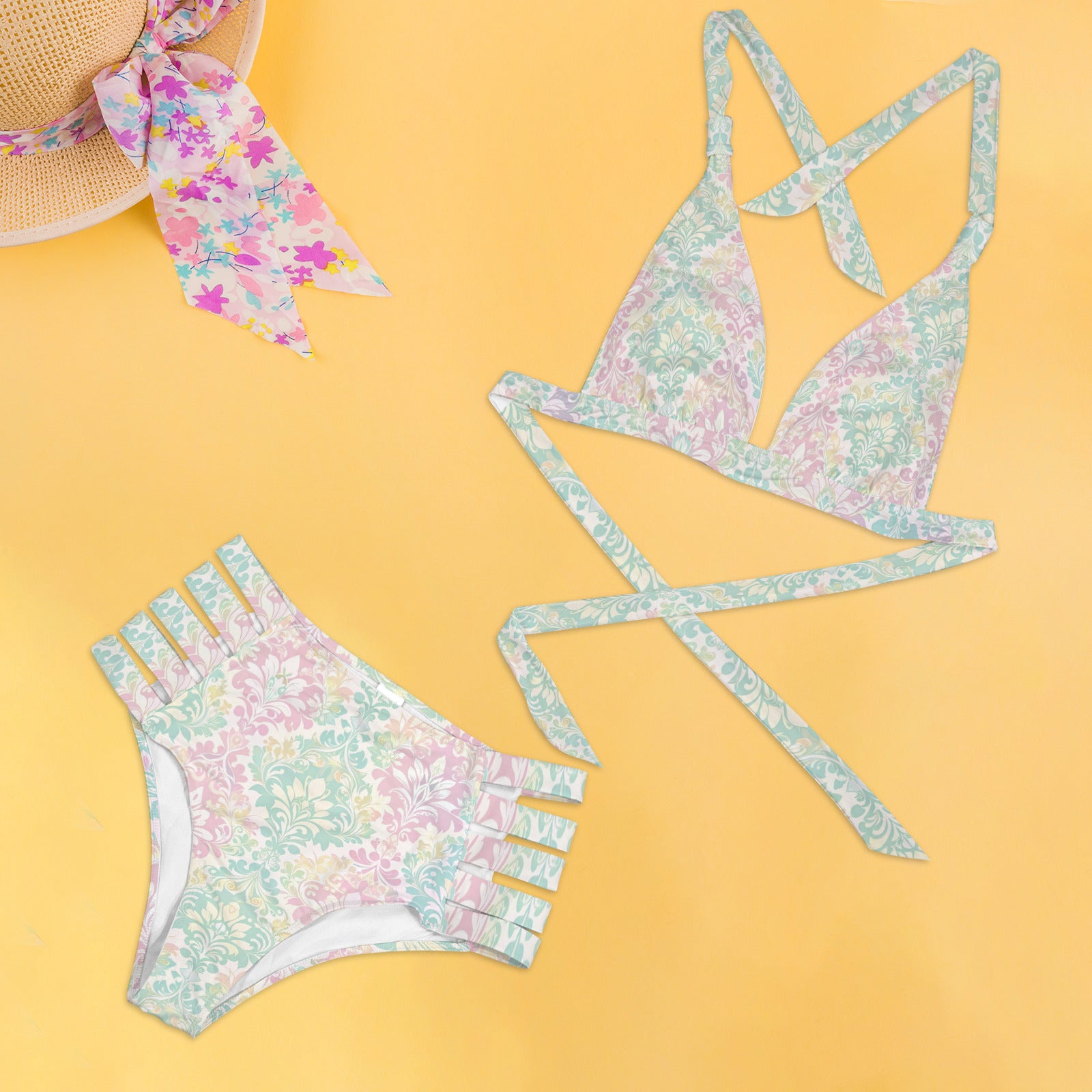 Flat lay pastel vintage bikini set with halter top and high waist bottom