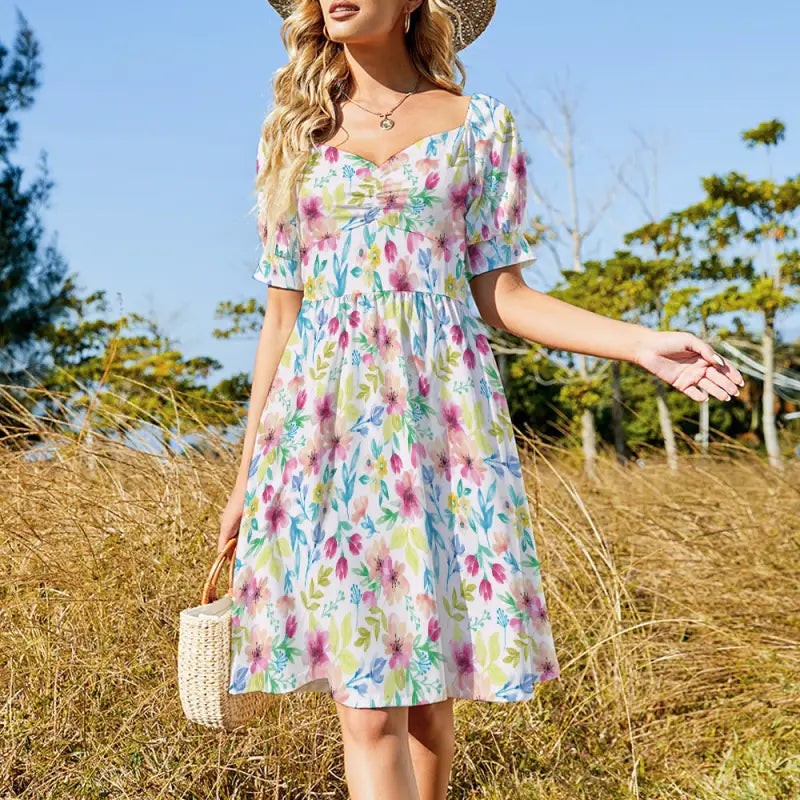Floral puff sleeve midi dress worn outdoors with flowy A-line silhouette
