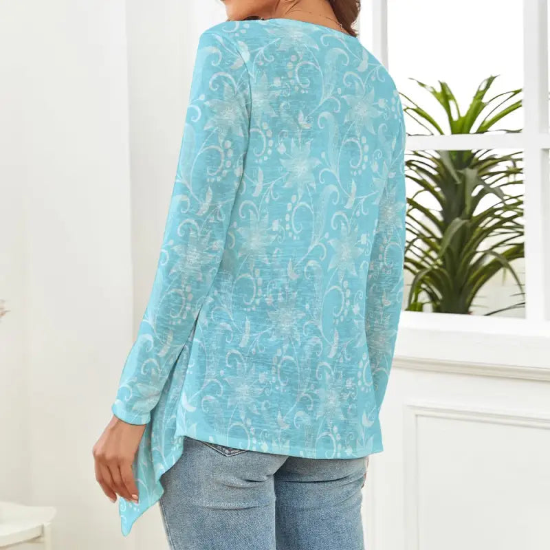 Lightweight aqua floral cardigan back view showing relaxed drape