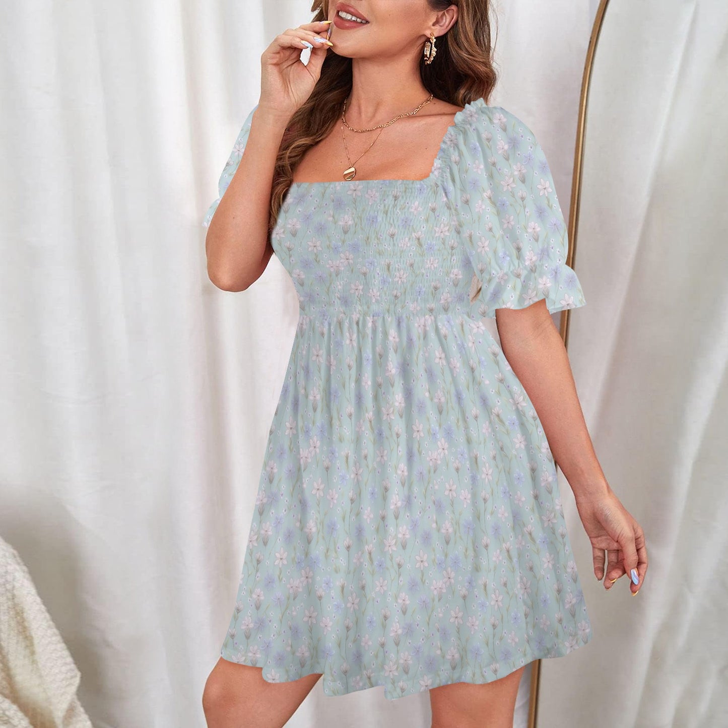 Lightweight blue floral mini dress with puff sleeves and soft A-line silhouette