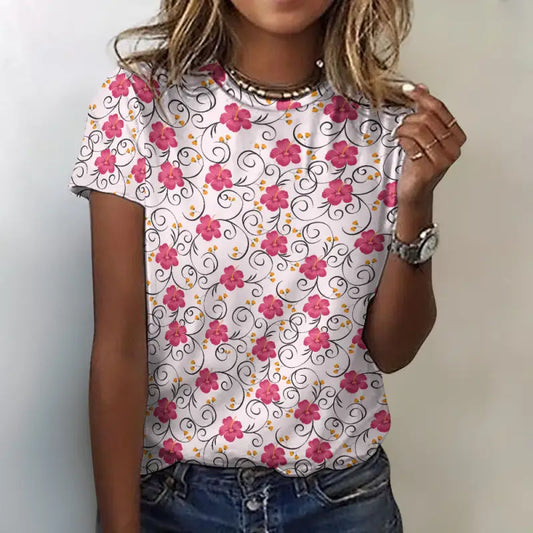 Pink 100% cotton floral t-shirt with pink blossoms and delicate vine print, modern feminine fit, styled with denim jeans