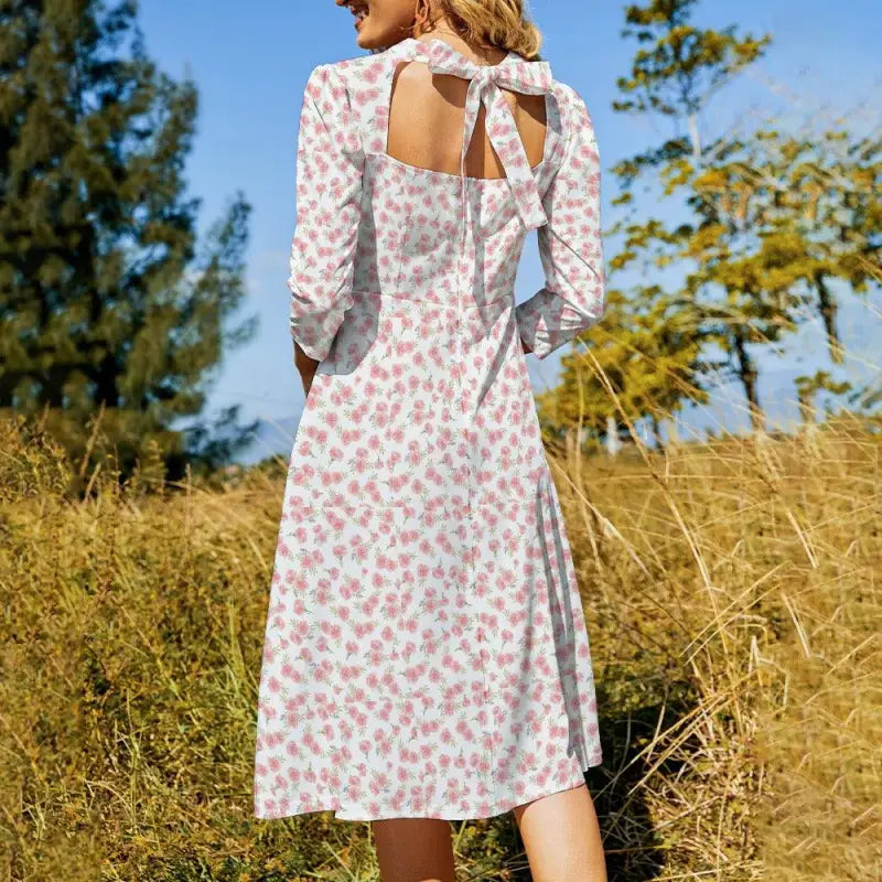 Pink cottagecore floral midi dress back view tie-neck detail